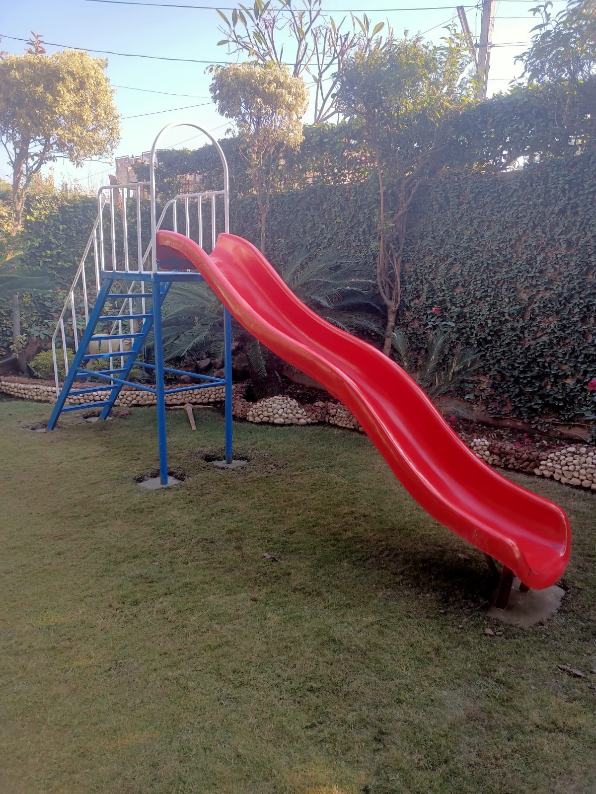 Red Curved Playground Slide
