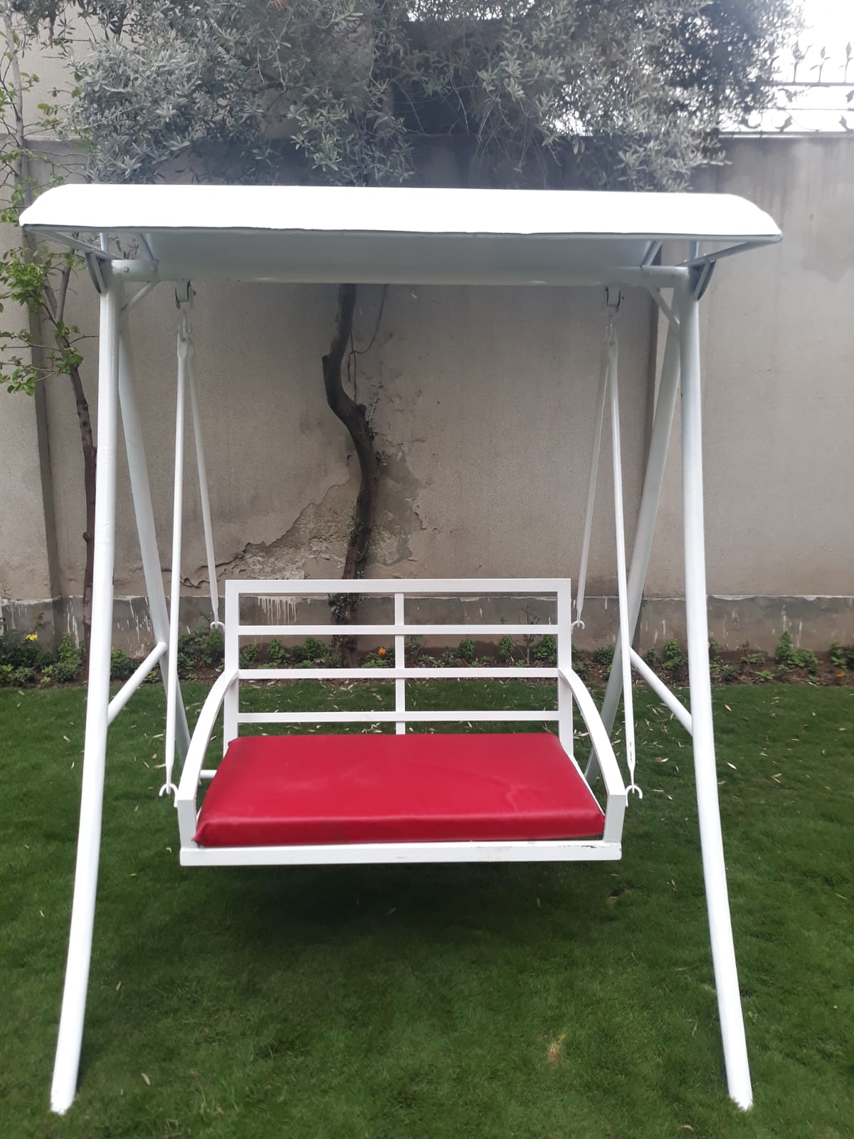 White Metal Garden Swing with Red Cushion